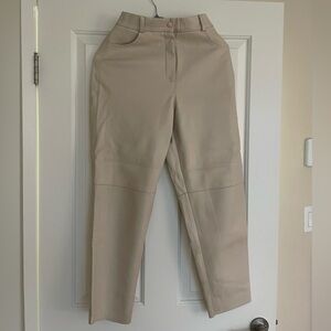 Cream leather pants.